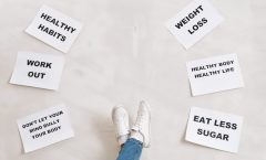 Inspirational health and fitness messages with shoe-clad feet, promoting healthy habits and wellbeing.